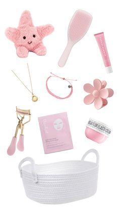 the contents of a white basket with pink items