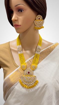 Yellow Kundan long necklace set/Kundan rani haar/Kundan Mala Set/Multi strand necklace/Indian jewelry/Kundan jewelry/Bridal necklace/wedding This is 100% Handmade jewelry. So Color, shades, texture displayed may slightly vary from the actual product due to digital image limitations. We request you to consider these minor variations. Please expect the possibility of some slight imperfections when buying handmade jewelry. If you have any questions, please message or email us. Arrives in a gift box Luxury Gold Kundan Necklace With Dual-tone, Luxury Yellow Gold Temple Jewelry Kundan Necklace, Luxury Yellow Gold Kundan Pendant Necklace, Luxury Gold Long Kundan Necklace, Luxury Hand-set Yellow Gold Kundan Necklace, Luxury Kundan Jewelry In Yellow Gold, Luxury Yellow Gold Kundan Necklace For Celebration, Kundan Mala, Kundan Long Necklace