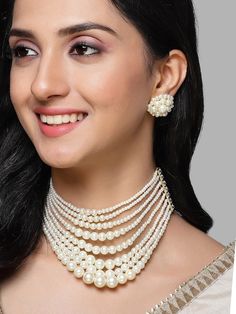 This jewellery set consists of a chocker necklace and a pair of earringsGold-plated necklace, has white beaded detail, and is secured with a drawstring closureA pair of matching earrings, each secured with a post and back closure Size & Fit Necklace Length: 20.5 cmWidth 10.5 cmEarring Length: 2.5 cm Width: 2.5 cm Material & Care Material: AlloyPlated: Gold-PlatedStone type: KundanCare InstructionsWipe your jewellery with a soft cloth after every useAlways store your jewellery in a flat box to avoid accidental scratchesKeep sprays and perfumes away from your jewelleryDo not soak your jewellery in waterClean your jewellery using a soft brush, dipped in jewellery cleaning solution only Dispatch within 7 days Jewelry Cleaning Solution, Chocker Necklace, Choker Necklace Set, Women's Jewelry Sets, Beaded Choker Necklace, Jewellery Set, Dress Jewelry, Beaded Choker, Wedding Wear