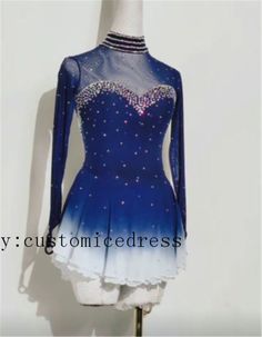 a blue and white figure skating dress on display