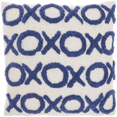 a blue and white decorative pillow with circles on it's side, in the shape of an xoxo pattern