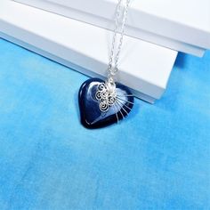 A Blue ceramic heart is artistically hand wire wrapped with non tarnish fine silver over copper wire to create a one of a kind pendant. he heart measures 1 3/4 inches by 1 3/4 inches and comes with a FREE coordinating chain with lobster claw clasp,measured to your preferred length. Your unique pendant necklace is ready to ship via USPS to your US location at no extra cost. (International shipping available. Please be aware of your local laws related to customs and VAT.) Wire Pendant Necklace For Gift, Wire Pendant Necklace As A Gift, Wire Wrapped Heart Pendant Necklace For Valentine's Day, Hand Wrapped Heart Pendant Jewelry Gift, Valentine's Day Wire Wrapped Heart Pendant Necklace, Unique Heart-shaped Wire Wrapped Necklace, Valentine's Day Heart Pendant Necklace, Wire Wrapped, Heart-shaped Wire Wrapped Necklace For Gift, Heart-shaped Wire Wrapped Necklace Gift