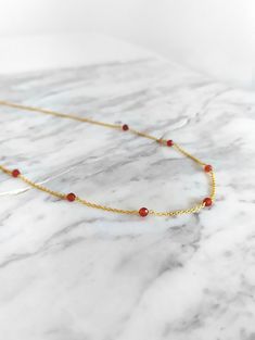 Ambrosia. Inspired by ambrosia, the food of greek gods. This necklace is composed of 14K gold vermeil delicate chain and natural carnelian gemstones. So pretty for everyday! It also makes a very cute gift! Gemstone bar is 1 inch/2,5 cm long You can choose between 4 chain lengths: 14 / 15 / 16 / 18 inches Not sure which length to buy? We can add a 1 inch extender chain. Just write a note at checkout! Other carnelian bracelet: https://www.etsy.com/listing/952670287 Similar necklace: https://www.et Delicate Charm Necklaces With Natural Stones For Gift, Delicate Charm Necklace With Natural Stones For Gifts, Delicate Natural Stones Charm Necklace For Gift, Yellow Gold Gemstone Chain Necklace Gift, Orange Necklace With Adjustable Chain As Gift, Orange Necklace With Adjustable Chain For Gift, Orange Choker Jewelry For Gift, Gemstone Pendant Chain Necklace As Gift, Dainty Orange Jewelry For Gifts