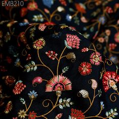 the black fabric has colorful flowers on it