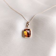 This stunning pendant is set in 14k Solid Yellow Gold with Natural Maderia Citrine with utmost precision. It is an unique gemstone pendant for nearly every occasion and is completely hassle-free jewelry. 🔷ABOUT GEMSTONE: Citrine, with its vibrant golden-yellow hues, is a gem of joy and abundance, radiating the warmth and energy of the sun. This captivating stone embodies qualities of positivity, success, and prosperity, believed to infuse one's life with a sunny disposition and enthusiasm. Citr Yellow Gold Topaz Gemstones As Gift, Amber Citrine Gemstones For Gift, Orange Jewelry With 17 Jewels As A Gift, Yellow Gold Citrine Gemstones For Gift, Elegant Orange Emerald Cut Jewelry, Orange Citrine Necklace Fine Jewelry, 14k Gold Amber Gemstone Necklace, 14k Gold Amber Gemstone Necklaces, Orange Faceted Jewelry Gift