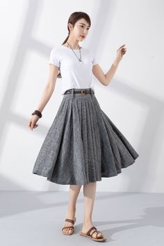 "Add some vintage-inspired charm to your wardrobe with our gray linen pleated swing circle skirt. Made from high-quality materials, it's both soft and durable, and perfect for keeping you looking and feeling your best. The unique pleated design adds a touch of classic elegance, while the swing circle cut gives the skirt a playful, feminine flair. Whether you're dressing up for a special occasion or keeping it casual for a day out with friends, this skirt is the perfect choice. Order now and add Fitted Gray Pleated Summer Skirt, Fitted Gray Pleated Skirt For Summer, Gray Cotton Pleated Skirt, Gray Fitted Pleated Skirt For Summer, Summer Gray Lined Skirt, Gray Long Pleated Skirt, Gray Cotton Skirt For Spring, Summer Gray Pleated Skirt, Gray Midi Skirt For Summer