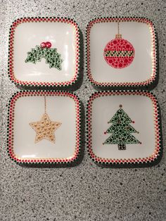 four small plates with christmas decorations on them