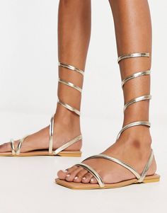 Truffle Collection wrap around minimal sandals in gold metallic | ASOS Gold Ankle Wrap Sandals For Party, Chic Gold Ankle Wrap Sandals, Metallic Summer Sandals With Wrapped Heel, Metallic Sandals With Wrapped Heel For Summer, Summer Metallic Sandals With Wrapped Heel, Spring Metallic Sandals With Wrapped Heel, Gold Ankle Wrap Sandals For Beach, Gold Flat Heel Lace-up Sandals For Party, Gold Lace-up Sandals With Single Toe Strap