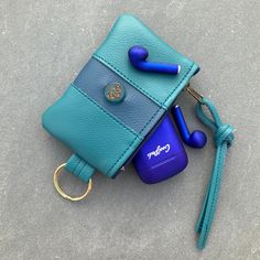 "Minimalist Wallet in 2 sizes. Slim, zip top Wallet or Organizer Bag is decorated with a Czech Glass Lotus Bead. Made from Super Quality Vegan Eco Leather. *Smaller size is 4 1/2\"wide and 3 1/2\"deep.Just right for Credit Credit Cards, Change or your EarPods . *Larger size is 6 1/2\"wide and 4 1/4\"deep. It's the Perfect size for glasses , Money, or Makeup or anything you need to organize .This size has a detachable Key Ring...so you could just carry this when you go to Yoga Class! Makes a grea Blue Rectangular Wallet With Key Clip, Green Coin Purse With Card Slots For Personal Use, Green Wallet With Mobile Phone Bag As Gift, Compact Blue Coin Purse For Everyday Use, Versatile Rectangular Coin Purse For Gifts, Versatile Rectangular Coin Purse As Gift, Pouch Coin Purse With Key Clip For Personal Use, Rectangular Zipper Pouch Card Holder For Personal Use, Green Wallet With Zipper Pouch For Personal Use