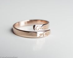 Engraved personalized name ring; wedding bands for women... Also perfect promise ring for your special woman ♡ ► FEATURES;Material Options: 14k Rose Gold, 14k Yellow Gold, 14k White GoldSize: All ring sizes are available► HOW TO ORDER;Please select your preffered size and material from the menu while adding to card.► PROCESSING & SHIPPING❥Your order will be handmade in 3-6 business days.❥Shipping time is 2-5 days to US.❥Please check the shipping times to other countries by writing your count Adjustable Promise Ring With Engraved Text, Customizable Engraved Open Ring For Promise, Personalized Engraved Rose Gold Ring, Minimalist Wedding Rings With Custom Name, Minimalist Custom Name Wedding Rings, Custom Name Engraved Ring In Rose Gold For Promise, Custom Name Engraved Rose Gold Ring For Promise, Personalized Rose Gold Engraved Ring For Promise, Custom Name Engraved Rose Gold Promise Ring