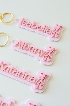 "These keychains make for the perfect accessory to your sport bags, diaper bags, luggage, etc.  𝐃𝐈𝐌𝐄𝐍𝐒𝐈𝐎𝐍𝐒/𝐌𝐄𝐀𝐒𝐔𝐑𝐄𝐌𝐄𝐍𝐓𝐒: Approx 4-5\" wide.  𝐋𝐎𝐂𝐀𝐋 𝐅𝐑𝐄𝐄 𝐏𝐈𝐂𝐊𝐔𝐏: If you live locally to or close to Miami,FL then we can arrange for a free pickup date at our shop. Please double check our current turn around time before purchase. Be aware that the dates for these signs are estimated by Etsy. They are not guaranteed ship or delivery dates! We strive to hit the estimated shipping date but drying times during each step of the process will determine when this sign ships. We will keep you updated on the shipping date for your sign.  Please not place an order and expect it to arrive before the estimated ship date without speaking with us first. And as with all orde Personalized Pink Rectangular Keychain, Personalized Rectangular Pink Keychain, Custom Name Pink Keychains For School, Customized Pink Keychains For Everyday Use, Customized Pink Rectangular Keychain, Custom Name Pink Rectangular Keychain, Pink Rectangular Custom Name Keychains, Everyday Pink Rectangular Keychains, Ballet Keychain