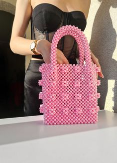 Tote shrimps bag. Pearl beaded bag in pink color. This beautiful tote bag will be a greate gift for anniversary. Bag size: *Height: 33 cm *Height without handles: 19 cm *Width: 16.5 cm *Lateral width: 10 cm *Handle drop: 14 cm *Weight: 750g Material: pink acrylic pearl beads 8mm. Bonus: free surprise for all orders. In addition to the gift, a hand-signed postcard with a message from the purse is attached to the order. If this is a present, be sure to write me the name of the recipient.  More pearl bags: https://www.etsy.com/shop/VitakaJewelry?ref=seller-platform-mcnav§ion_id=29560344 !!Please be aware that some countries impose customs fees and taxes for packages that enter your country.  These fees are kept by your government and outside of your purchase with me. *If you are running out o Pearl Beaded Bag, Pink Handbag, Wedding Handbag, Pearl Pink, Pearl Bag, Pink Handbags, Pink Acrylics, Vintage Pearl, Luxury Bag