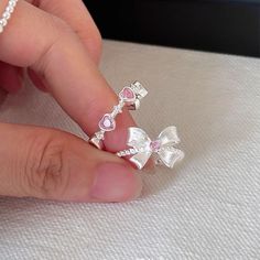 📌 Please Note: When adjusting the ring, please squeeze or expand the ring body slowly and gently. 💎 Materials: 18k White Gold Plated over Solid Sterling Silver Body - Hypoallergenic and Tarnish-Free Cubic Zirconia Matte Finish 📐 Size: Adjustable Open Design - Size 5+ Cute Pink Rings, Silver Girly Jewelry, Adjustable Pink Rings For Proposal, Diamond White Cubic Zirconia Couple Rings As Gift, White Cubic Zirconia Crystal Ring As Gift, Diamond White Crystal Open Ring Gift, Diamond White Crystal Open Ring As Gift, Gift Open Ring Couple Rings In Diamond White, Diamond White Open Crystal Ring As Gift