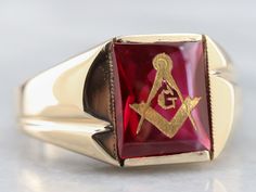 This vintage red ruby glass Masonic ring features polished, structurally simple shoulders, and a simple rectangular shape. The center is a classic red ruby glass cabochon, inlaid with the gold Masonic symbol, with a nice flat profile. Metal: 10K Yellow Gold Gem: Ruby Glass Gem Measurements: 12.0 x 10.1 mm, Rectangle Ring Size: 12.50 Marks: "10K" Stamped on the inside band Masonic Symbol, Mens Vintage Jewelry, Gem Ruby, Rectangle Ring, Masonic Symbols, Right Hand Ring, Jewelry Mens, Masonic Ring, Best Flats