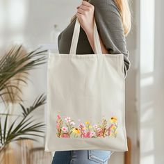 This 100% cotton bag comes in one size - 15" x 16"- perfect for everyday wear. While the canvas material will show off your designs in great colors, it's durable and will last for years. The bag features 20" handles (made from the same canvas), making it easy to carry even with a week's worth of shopping. .: 100% cotton canvas .: Available in natural color .: Heavy fabric (12 oz/yd² (406.9 g/m .: Sewn-in label Multicolor Canvas Bag For Spring, Spring Multicolor Canvas Bag, Cotton Bags For Everyday Use In Spring, Multicolor Cotton Bags For Spring, Eco-friendly White Canvas Bag For Spring, Spring Cotton Bags For Gifts, Spring Cotton Bags Perfect As Gifts, Spring Gift Cotton Bag, Spring Gift Cotton Bags