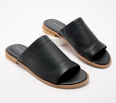 Slide these genuine leather sandals right into your cart! Their modern, minimalistic design makes them your go-to shoe for pairing with everything in your sunny-season closet. From Kelsi Dagger. Sleek Mules With Leather Sole For Spring, Modern Leather Slides With Flat Heel, Classic Slip-on Footbed Sandals For Summer, Modern Slide Sandals With Leather Sole, Modern Leather Footbed Sandals With Textured Sole, Open Toe Footbed Sandals For Everyday Spring Wear, Classic Footbed Sandals For Summer Vacation, Classic Summer Footbed Sandals For Vacation, Modern Everyday Slip-on Slides