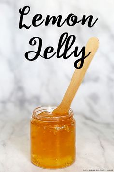 a wooden spoon with lemon jelly in it