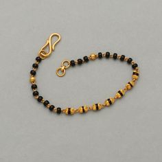 Gold Jewelry With Black Beads For Puja, Black Bracelets For Festivals, Black Festive Bracelets For Festivals, Traditional Gold Bracelets With Black Beads, Black 22k Gold Jewelry With Round Beads, Baby Bracelet Gold, 22k Gold Bracelet, Kids Gold Jewelry, Black Beaded Bracelets