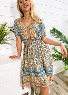 The Anna-Kaci dress boasts a sultry tie-back design, with a flirty v-neckline and a floral print. It also features short sleeves, a high-low hem, and an above-the-knee length for a perfect summer look. Complete the ensemble with a straw hat and sunnies for a stunning outfit this season. It perfectly fits the vibe of our Sunday dresses collection and works great as an Easter dress too. Made of 100% cotton blend material for a comfortable feel. Product measurements: Length - 48-50 inches (Small), Sunday Dresses, Summer Wrap Dress, Summer Wraps, Bohemian Print, Stunning Outfits, Printed Wrap Dresses, Easter Dress, Curvy Dress, The Vibe