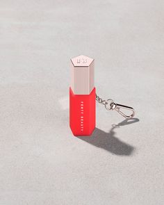 A Fentybeauty.com exclusive: Never let your favorite lip oil-gloss leave your side. Latch on your Gloss Bomb Oil to this keychain holder to clip anywhere for easy access to shine. Keychain Holder, Shiny Lips, Car Essentials, Buy List, Key Chain Holder, Fenty Beauty, Lip Oil, Lip Moisturizer, To Shine