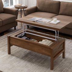 a coffee table with an open drawer underneath it on a rug in a living room