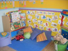 a child's playroom with toys and books