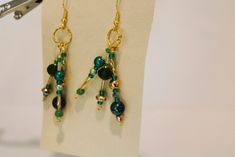 These pierced earrings have three hanging and swinging dangles.  Each has green pearls in shades of green and a green crystal. Felted Earrings, Denim Earrings, Metalwork Jewelry, Chunky Earrings, Green Pearls, Leftover Fabric, Upcycled Fashion, Green Crystal, Crystal Drop Earrings