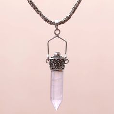 A single crystal quartz prism brings a touch of glamour to this necklace by Balinese jewelry artisan Made Sugi. A clear quartz crystal sits in an ornate sterling silver setting featuring nature-inspired vine motifs. An elegant purple amethyst graces the top of the pendant. Silver Quartz Round Pendant Jewelry, Spiritual Quartz Jewelry With Natural Stones, Spiritual Quartz Pendant Jewelry, Silver Bohemian Crystal Necklaces With Gemstone, Silver Bohemian Crystal Necklace With Gemstone, Bohemian Silver Crystal Necklace With Gemstone, Healing Quartz Wire Wrapped Jewelry, Silver Sterling Silver Crystal Necklaces With Natural Stones, Bohemian Sterling Silver Crystal Necklace