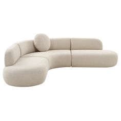 a white couch with pillows on the back and side, sitting in front of a white background