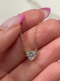 This is amazing heart shape diamond solitaire pendant lab grown diamond cvd it is set in solid 14k white, yellow, rose gold  FREE SHIPPING AND 30 DAYS RETURNS  DIAMOND DETAILS : diamond wight: 1 carat  color: d-e clarity: vs1 type: lab grown diamond cvd shape: heart shape gold metal: 14k white, yellow ,rose gold diamond wight: 0.80 carat  color: d-e clarity: vs1 type: lab grown diamond cvd shape: heart shape gold metal: 14k white, yellow ,rose gold diamond wight: 0.50 carat  color: d-e clarity: Gold Diamond Chain, Heart Shaped Diamond Pendant, Diamond Solitaire Pendant, Chain Heart, Heart Necklace Diamond, Heart Shaped Diamond, Diamond Chain, Solitaire Pendant, Sweet Sixteen