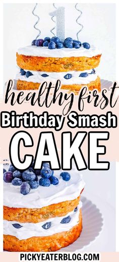 a cake with blueberries on top and the words healthy first birthday smash cake above it