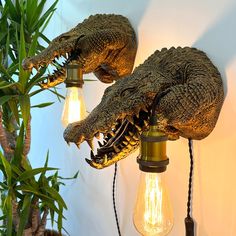 two alligator head lights are attached to the wall