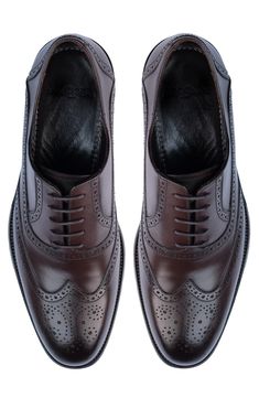 Handmade of smooth leather, this wingtip toe dress shoe with a classic oxford silhouette offers a sophisticated, elegant look. Leather upper and lining/synthetic sole Made in Turkey Classic Goodyear Welted Lace-up Dress Shoes, Luxury Wingtip Lace-up Business Shoes, Timeless Wingtip Oxfords For Business Casual, Luxury Wingtip Lace-up Shoes For Business, Classic Lace-up Oxford Shoes With Leather Sole, Timeless Wingtip Derby For Business, Timeless Business Wingtip Derby Shoes, Elegant Brogue Derby Shoes For Business, Classic Formal Lace-up Derby Shoes