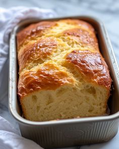 a loaf of bread in a metal pan