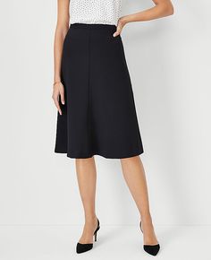 Elevate your wardrobe with the Ann Taylor Flare Skirt in Fluid Crepe, a testament to sophisticated style with a playful twist. This skirt is designed to capture the essence of femininity and structured elegance.

- Size: 0
- Color: Black
- Gender: Female
- Material: 95% Polyester, 5% Spandex
- Length: 27 inches, hits at knee
- Fit: Tailored fit
- Closure: Hidden back zipper with hook-and-eye
- Care Instructions: Machine washable

Crafted from a high-quality blend of polyester and spandex, this s Below Knee Skirt Outfits, A Line Work Skirt, Skirts For Women Over 60 Years Old, Black Womens Suit, Work Skirt Outfit, A Line Skirt Outfits, Black Knee Length Skirt, Suit Skirts, Ponte Skirt