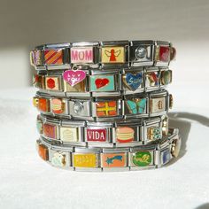 *This listing is for 1 Italian Charm Stretchy Stainless Steel Bracelet. Length is adjustable* Italian Charm Bracelets are back! Straight from the 2000s! Each bracelet is carefully crafted with randomly selected "mystery box" charms. The bracelet will be designed by us, but please leave a note in the "Personalization" Section, so we can better tailor your bracelet to your taste!  Sizing: Each bracelet has 17 charms which is 6.5" -7" in length. Bracelets are stretchy and adjustable in size, but if Adjustable Novelty Charms Bracelets, Vintage Adjustable Beaded Bracelets With Charms, Vintage Adjustable Charm Bracelet For Everyday, Retro Multicolor Bracelets For Gift, Retro Multicolor Bracelets As Gift, Multicolor Retro Bracelets For Gift, Multicolor Retro Bracelet For Gift, Multicolor Retro Bracelet As Gift, Retro Yellow Adjustable Bracelets