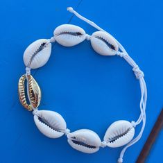 This beautiful nautical bracelet is hand made with Cowrie seashell. cowrie sea shell bracelet white cord roope silver plated sea shell naturel cowrie shells All my jewelery is hand crafted with pure and 925 sterling silver , this is a safe way for you to store necklace will be sent along with a beautiful gift box and pouch White Shell Bracelet For Vacation, White Strand Bracelets For Vacation, White Strand Bracelet For Vacation, White Shell Beachy Bracelets, White Shell Bracelets For Summer, Beachy White Shell Bracelets, White Shell Beachy Bracelet, White Beachy Shell Bracelet, Adjustable White Shell For Beach