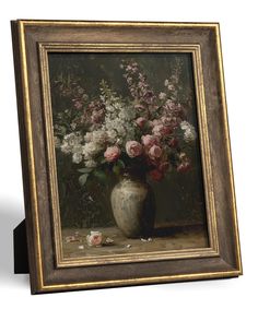 a painting of flowers in a vase on a table next to a white wall with a gold frame