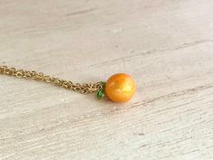 This dainty orange / tangerine necklace is made of the following: (1) Gold plated orange slice charm (charm size: 12 x 8.5mm) (2) Gold plated or 14KGF chain and findings ✏️ Please choose the length of the chain (the length includes clasp and findings) ✏️ Please choose your desired plating of chain ❣️ If you are unsure about which length to choose , please leave me a note to request an extension chain to be added to the chain at check out. 🍊EARRINGS 🍊 Threader -> https://www.etsy.com/listing Delicate Peach Jewelry For Gifts, Adjustable Peach Jewelry For Gifts, Peach Necklace Gift, Peach Round Necklace For Gift, Peach Round Necklace Gift, Round Peach Necklace For Gift, Gift Round Peach Necklace, Orange Pendant Charm Necklaces For Gifts, Adjustable Round Orange Necklace