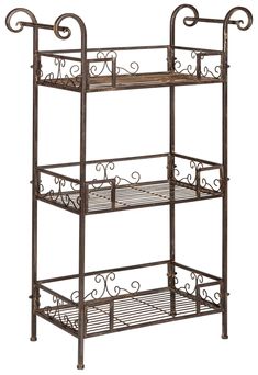 Taking inspiration from Victorian antiques, this Noreen Shelf imbues any outdoor area with vintage charm and romantic ambiance. The flourishing iron scrolls in a rustic brown finish give Noreen's three shelves elegant character, making it ideal for the porch or patio. Safavieh Noreen 42.3-in H x 28.3-in W Rustic Brown Outdoor Rectangular Wrought Iron Plant Stand | PAT5006B Three Tier Shelf, 3 Tier Shelf, Wrought Iron Plant Stands, Victorian Antiques, Outdoor Shelves, Iron Plant Stand, Tier Shelf, Iron Plant, Rustic Living