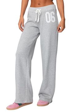 Sporty numbering at the thigh lends ultracool athletic style to these cozy cotton-blend sweatpants made with trendy wide legs. Elastic/drawstring waist 50% cotton, 50% polyester Machine wash, dry flat Imported Full-length Drawstring Sweatpants For Sports, Full Length Drawstring Sweatpants For Sports, Wide Leg Cotton Sports Bottoms, Sporty Sweatpants With Letter Print For Loungewear, Sporty Letter Print Sweatpants For Loungewear, Casual Letter Print Sweatpants For Loungewear, Sporty Cotton Sweats For Leisure, Sporty Cotton Wide Leg Sweats, Sporty Wide Leg Cotton Bottoms