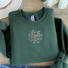 Embroidered Sweatshirt is made to order.   Great gift!  Thread colors may need to change, depending on choice of sweatshirt color.  I will send a mockup after purchase. First three photos and thumbnail are mockups to show a different color option with design. If you need a 3XL or 4XL, send me a message and I will see what I can do with color and style. Hoodies With Embroidery, Green Embroidered Crew Neck Hoodie, Casual Green Sweatshirt With Embroidery, Fall Hoodie With Crew Neck And Machine Embroidery, Fall Crew Neck Hoodie With Machine Embroidery, Winter Hoodie With Crew Neck And Machine Embroidery, Crew Neck Hoodie With Machine Embroidery For Fall, Green Long Sleeve Sweatshirt With Machine Embroidery, Green Crew Neck Sweatshirt With Machine Embroidery