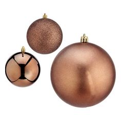 two shiny ornaments are shown on a white background, one is brown and the other is gold