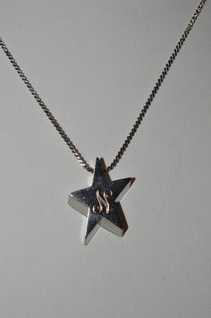 "DESCRIPTION:  Silver alloy star with the letter \"N\" engraved. Chain approximately 15\". Article      1050130 Color      Silver Material      Alloy Size              Total Length - approximately 16.5\" Pendant        3/4\" Shape        Quantity1 Origin     China - To see all the necklaces in my shop: http://www.etsy.com/shop/ReflectionOtherSide/search?search_query=necklaces SHIPPING: I ship quickly but holidays and Sunday prevent next day mailing so please if you place an order on those days allow me an extra day to get your items in the mail. All items I ship are either in puff pad envelopes or gift boxed to prevent damage to the item. SUGGESTIONS: I welcome any comments, questions or suggestions. I am always looking to improve my store and assist my guests any way I can. OTHER SHOP(S): N Necklace, The Letter N, Silver Star Necklace, Star Necklace Silver, Letter N, Those Days, Silver Material, Silver Stars, Star Necklace