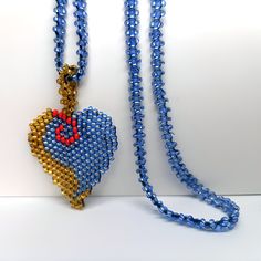 Figure: Heart Material: Glass Bead Color: Blue, Bronze, Red For whom: Women    PRODUCT SIZES Pendant Width: 50 cm Strap Height: 21.50 cm Necklace Length: 26 cm Handmade Heart Necklace With Round Beads, Handmade Heart Necklace With Round Beads For Gifts, Blue Heart Beads Necklace As Gift, Heart Pendant Beaded Necklace For Gift, Colorful Beads Heart Shaped Beaded Necklace Gift, Handmade Heart Pendant Beaded Necklace As Gift, Heart Shaped Beaded Necklace For Gift, Heart Shaped Colorful Beaded Necklaces For Gifts, Blue Heart Necklace For Valentine's Day Jewelry Making