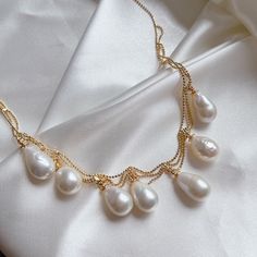 Item Information: -ready to ship -material: 10-11mn teardrop Edison high luster and high quality freshwater pearls, 14k gold plated, brass -length: 40cm + extension 5cm -adjustable length  -due to the nature of freshwater pearls, it has some flaws -come with a gift box Shipping policy: Domestic orders will be shipped via Canada Post with tracking number, should arrive in 3-5 business days, but some delays may occur, please be patient with your order. US orders will be shipped via Canada Post tra Teardrop Pearl Necklace With Pearl Charm, Teardrop Pearl White Pearl Necklace, Delicate Drop-shaped Pearl Necklace With Pearl Chain, Pear-shaped Pearl Drop Necklaces, Teardrop Pearl Necklace With Pearl Chain, White Pearl Dangle Necklace With Clavicle Chain, Drop Pearl Pendant Necklace, Baroque Pearl Teardrop Jewelry With Pearl Chain, Teardrop Baroque Pearl Chain Jewelry