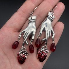 Drench your ears with these sultry Bleeding Heart Earrings with Red Blood Drops! Make a statement with these romantic gothic earrings, and let everyone know you have a heart of darkness. 'Tis a (blood) thirsty accessory to add to your wardrobe! Metals Type: Zinc alloy Vampire Ghost, Just Aesthetic, Witchcraft Jewelry, Dripping Blood, Vampire Earrings, Red Gothic, Blood Drop, Gothic Vampire, Carved Heart