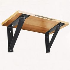 a wooden table with black metal legs and a sign that says pawwood not included