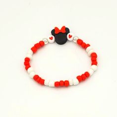 This stretchy, beaded Minnie or Mickey Mouse bracelet is excellent for layering. Hand crafted by the Sharing Sunshine team, this 7.5" glass bead jewelry should fit snug to the wrist. Size, sayings, bead colors, bead layout, etc. are fully customizable. Perfect for someone heading to Orlando soon or to show your love to a huge Disney fan. Mickey Beaded Bracelet, Minnie Mouse Bracelet, Mickey Mouse Bracelet Diy, Mickey Bead Bracelet, Disney Beaded Bracelet Diy, Disney Beads Bracelet, Disney Seed Bead Bracelet, Disney Bead Bracelet Ideas, Disney Bracelet Ideas