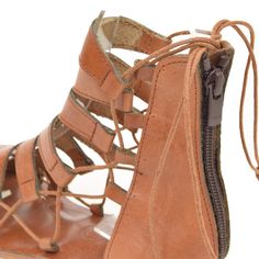 COLOR: Tan LEATHER TYPE: Vegetable Leather MATERIAL: Made from %100 leather. SOLE: Leathery IN SOLE : %100 leather. HEEL HEIGHT: 1.5 cm DESIGN: Lace-up & Zippered GENDER: Women's The FIBO Hera Tan Leather Sandal is expertly crafted with %100 leather, a zipper back closure, and an ergonomic heel design for comfort. These shoes are handcrafted and expertly stitched by skilled artisans for a unique pair of sandals. Leather Ankle Strap Lace-up Sandals With Leather Footbed, Leather Lace-up Sandals With Removable Insole, Leather Lace-up Sandals With Removable Insole And Flat Heel, Leather Huarache Sandals With Flat Heel, Leather Huarache Sandals With Ankle Strap, Leather Lace-up Sandals With Flat Heel, Leather Woven Ankle Strap Huarache Sandals, Leather Woven Huarache Sandals With Ankle Strap, Leather Huarache Sandals With Removable Insole And Ankle Strap